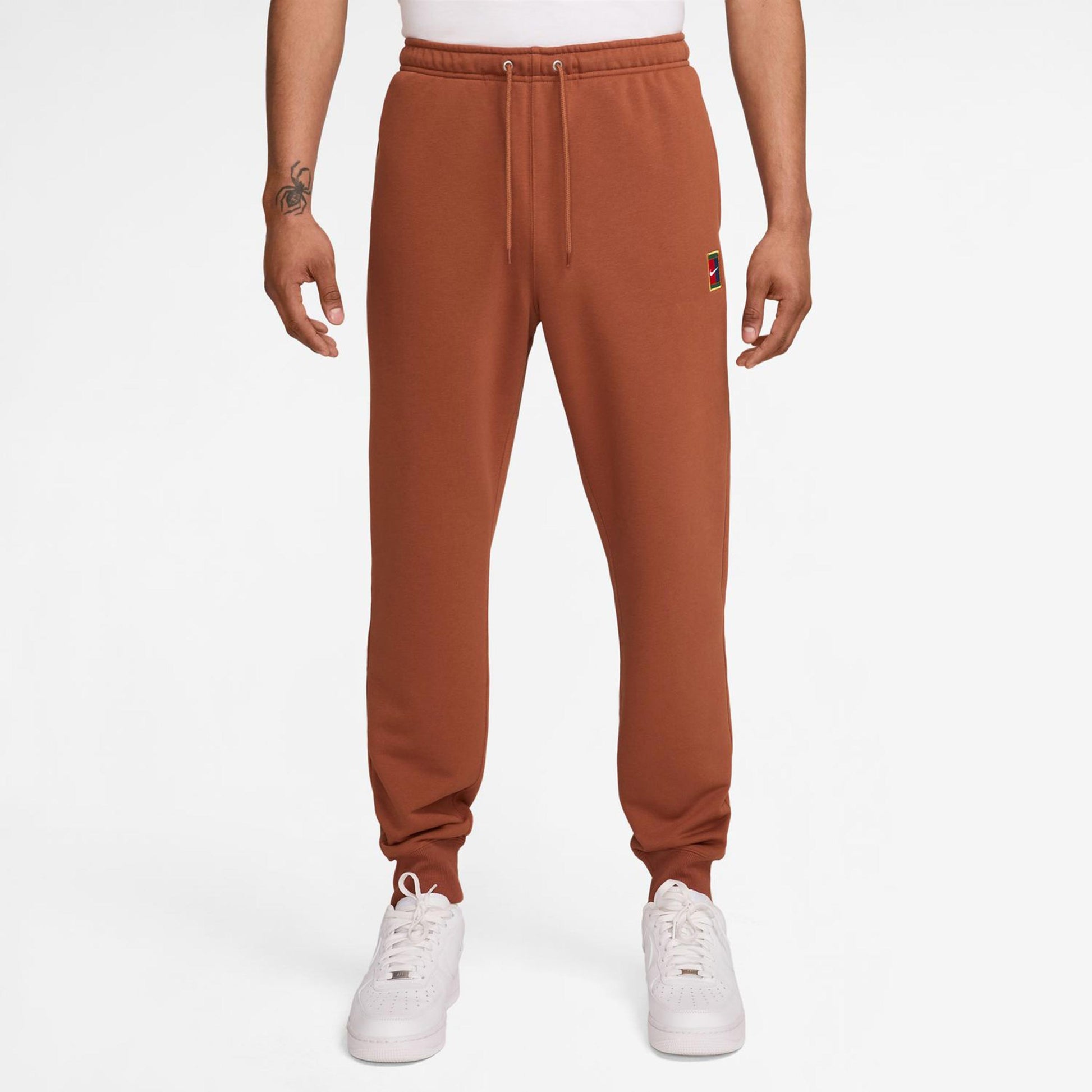 Nike Court Dri-Fit Heritage Fleece Trainingshose Herren-Rost